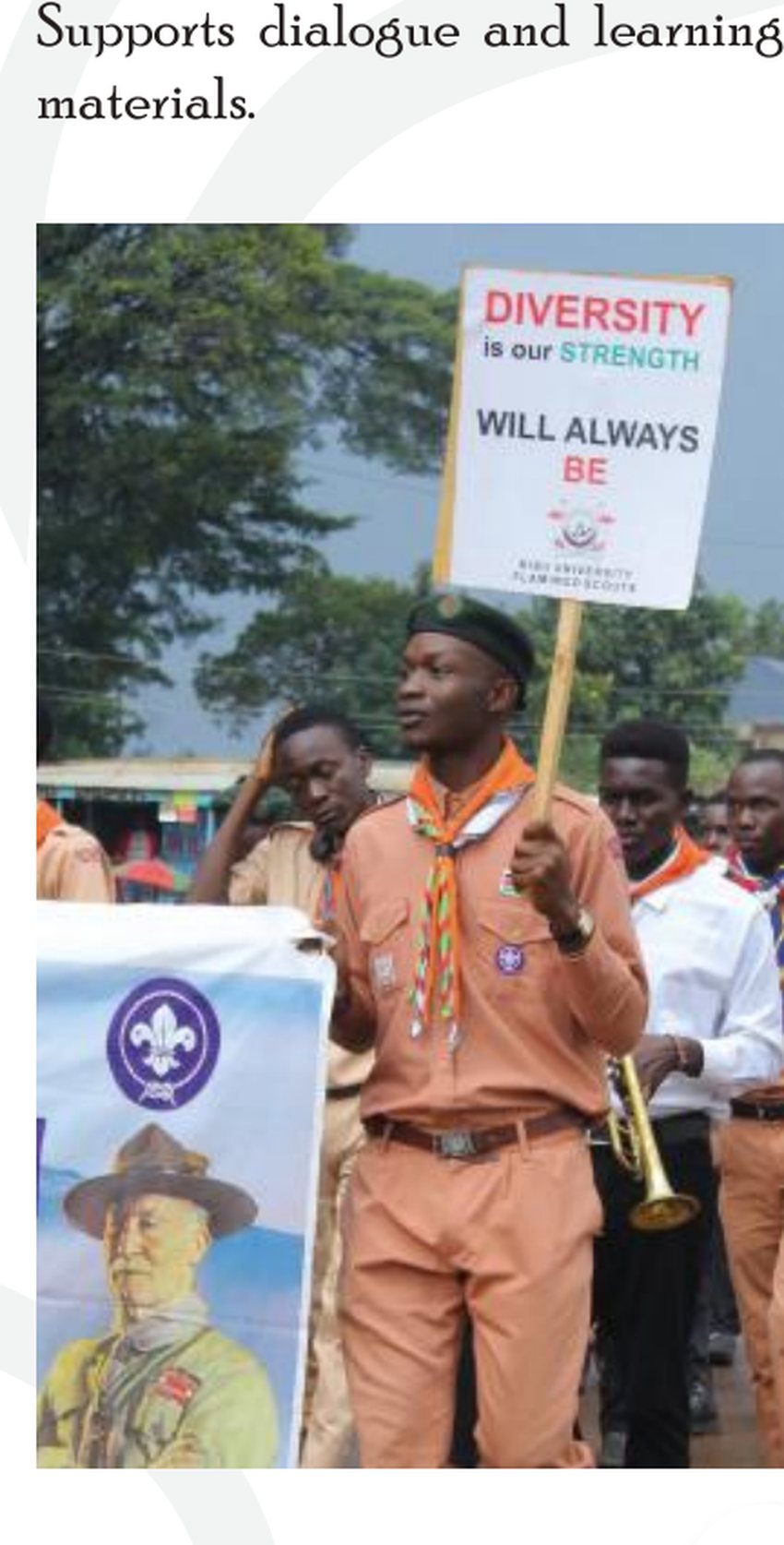 Scout holding a diversity placard during peace messaging